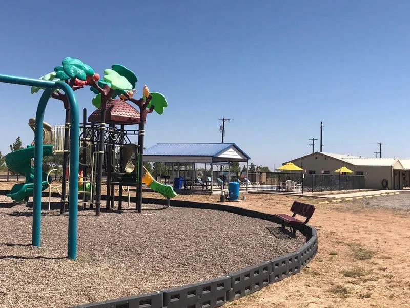 Playground equipment at Mesquite Oasis Lodge & RV Park in Odessa, Texas
