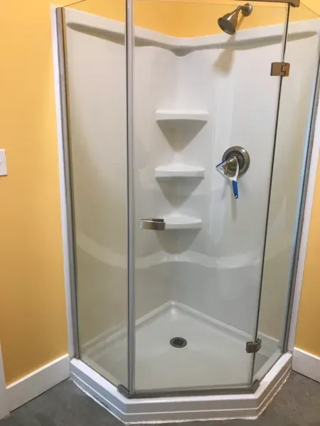 Private shower stall at Mesquite Oasis Lodge & RV Park in Odessa, Texas